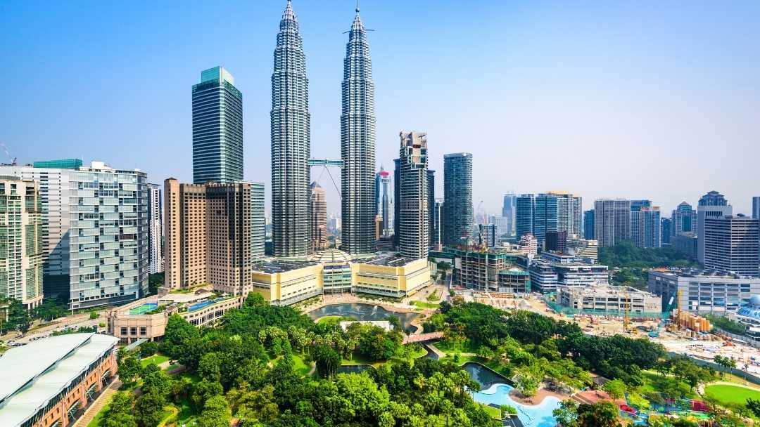 Kuala Lumpur city featuring the Petronas Towers.